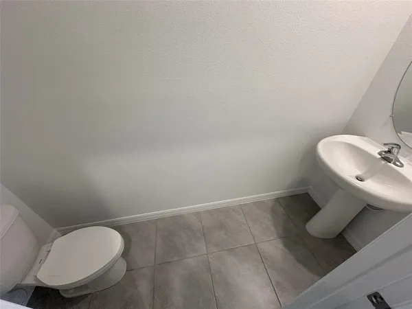 a view of an empty room window and wooden floor