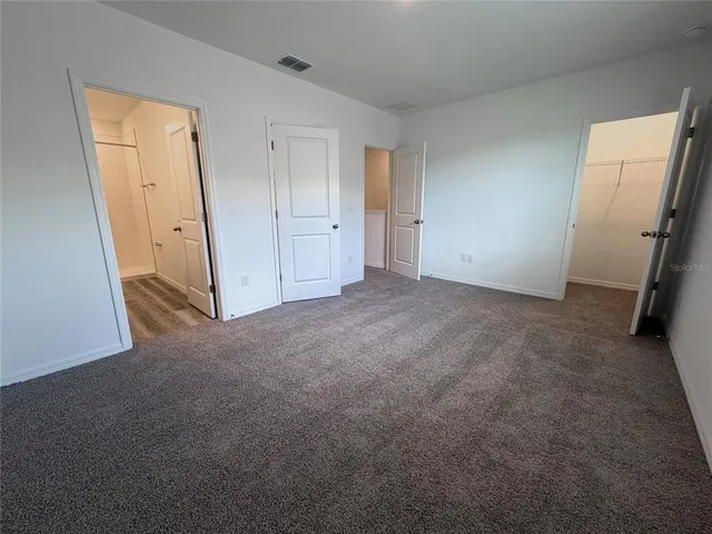 a view of a room with racks on the wall