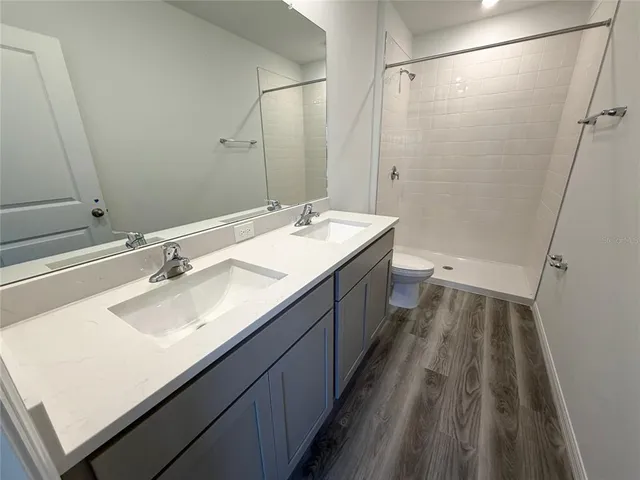 a bathroom with a toilet and shower