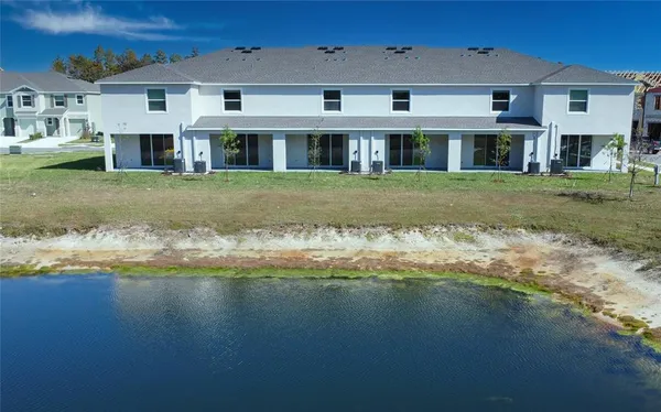 a view of a swimming pool and lounge chairs