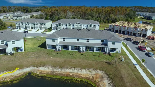 a view of a swimming pool and lounge chairs
