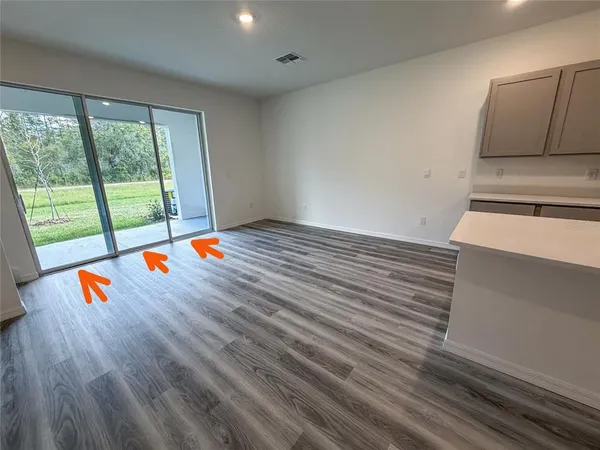 a kitchen with stainless steel appliances a refrigerator a sink a stove and microwave