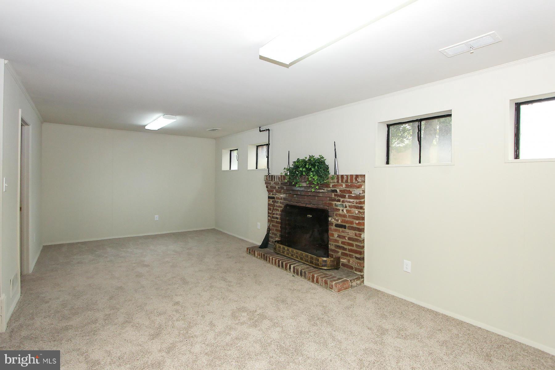 2609 Woodedge Road Silver Spring, MD 20906 - Photo 20 of 30 LOWER LEVEL, NEW CARPET, WOOD-BURNING FIREPLACE