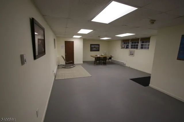 a view of a hallway with seating area