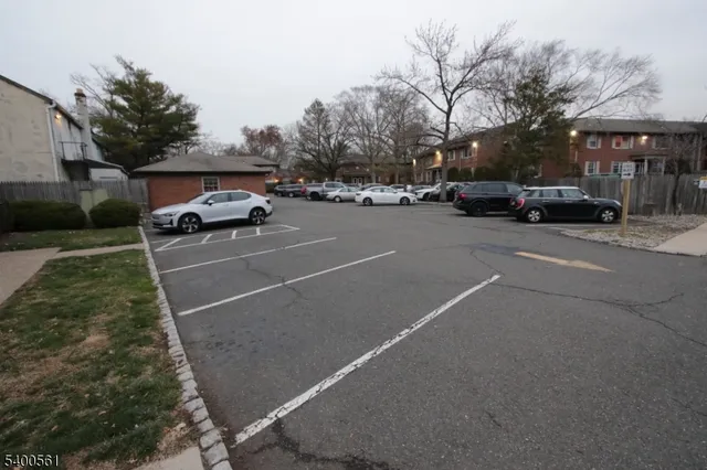 a view of street with parked cars