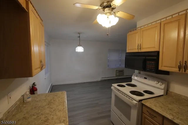 a kitchen with a stove and a microwave