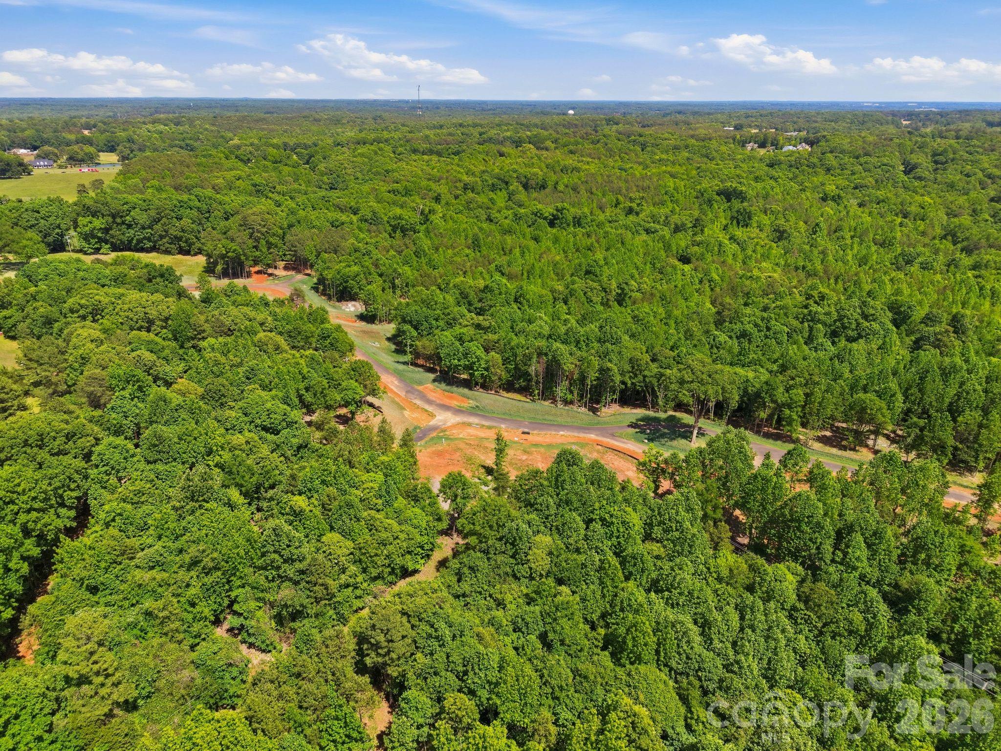 5833 Bentley Ridge Drive, Unit 9 Davidson, NC 28036 - Photo 2 of 5 a view of a outdoor space and a yard