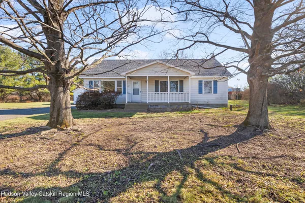 a house with a large tree in front of it
