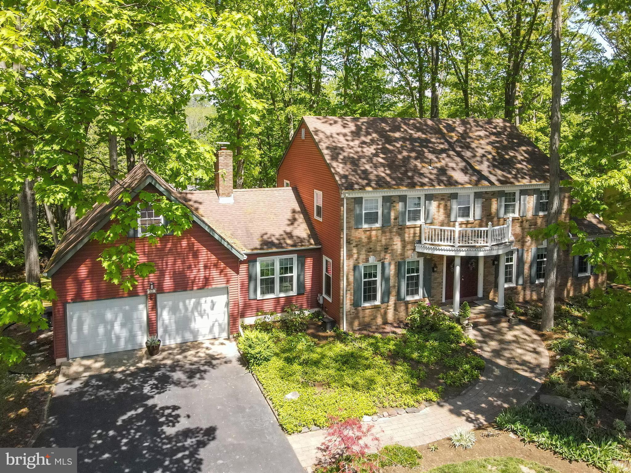 This home is nestled in a wooded area.