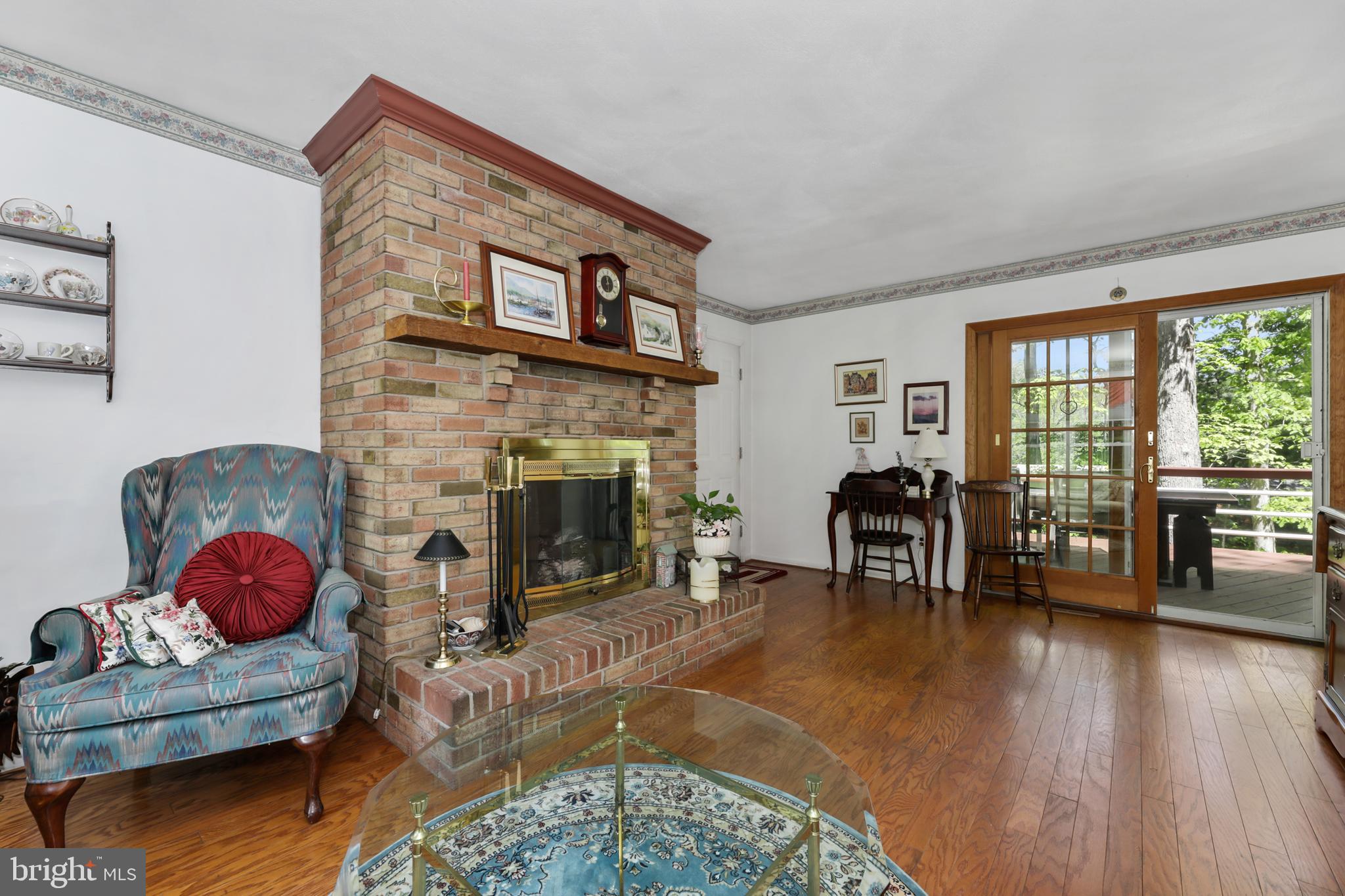 60 Lochatong Road Ewing, NJ 08628 - Photo 15 of 29 Living room with gas fireplace and door to deck.