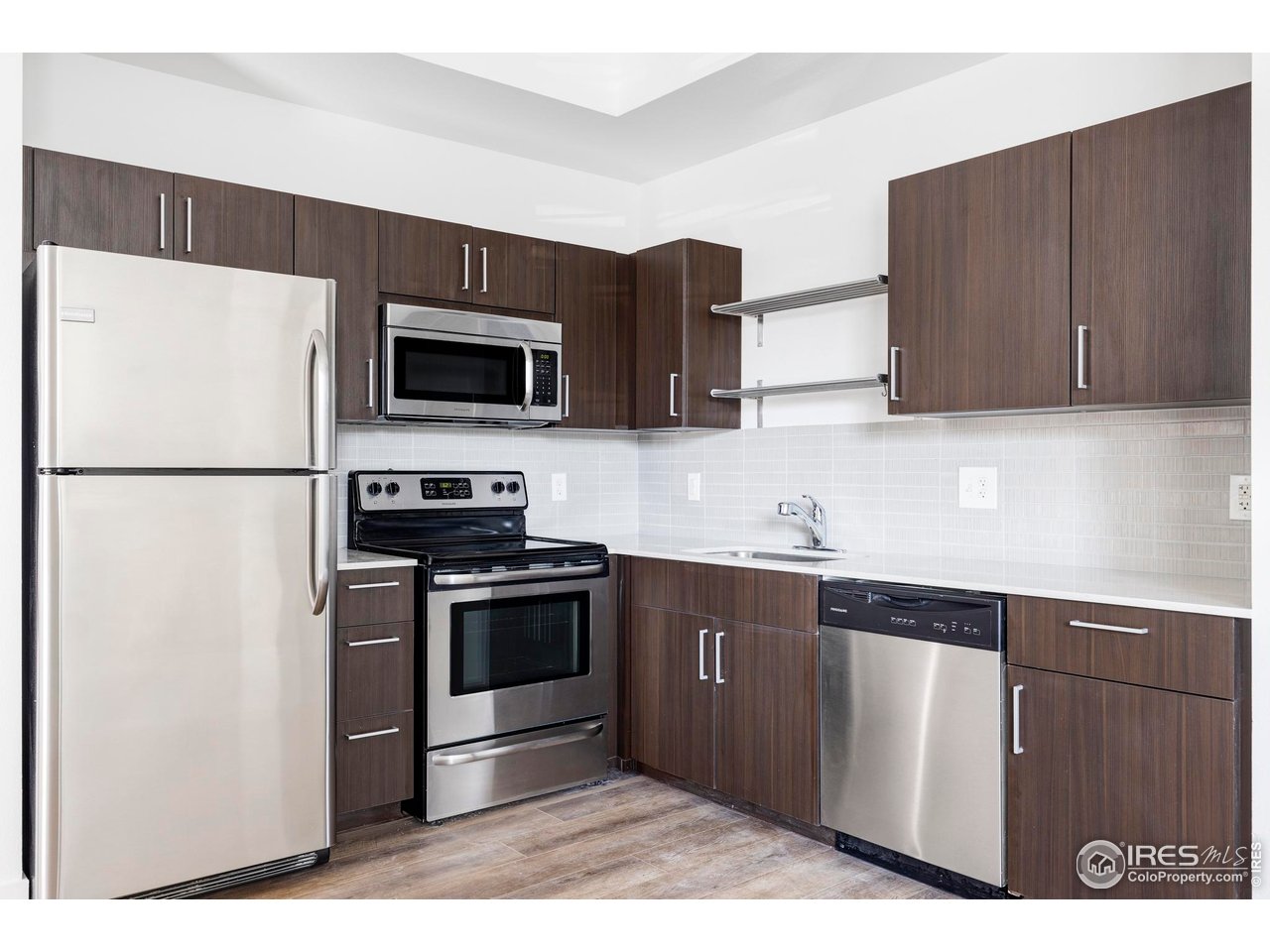 1707 Walnut Street, Unit 208 Boulder, CO 80302 - Photo 16 of 30 a kitchen with stainless steel appliances granite countertop a refrigerator stove a sink and dishwasher