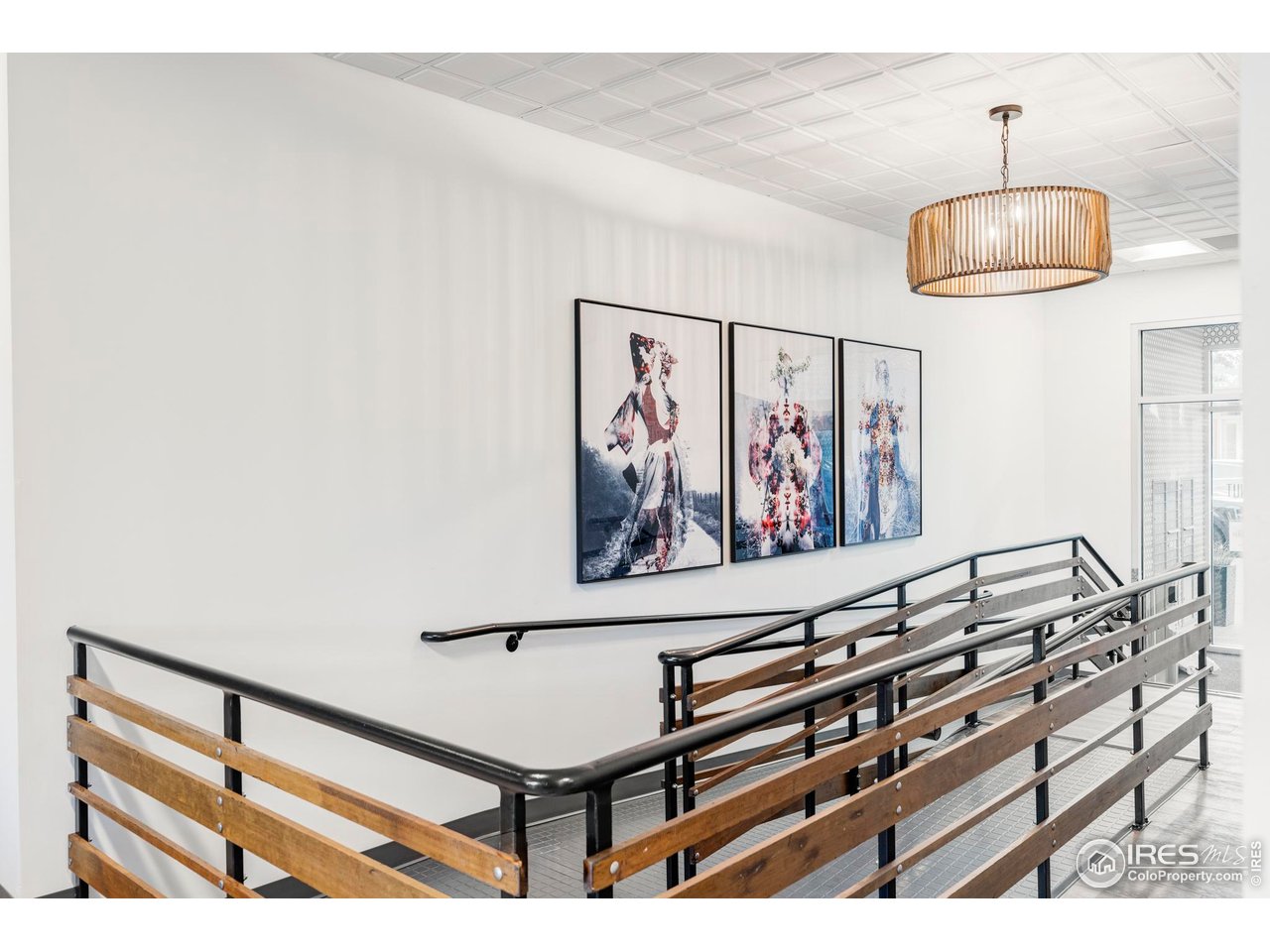 1707 Walnut Street, Unit 208 Boulder, CO 80302 - Photo 22 of 30 a view of a room with paintings on the wall