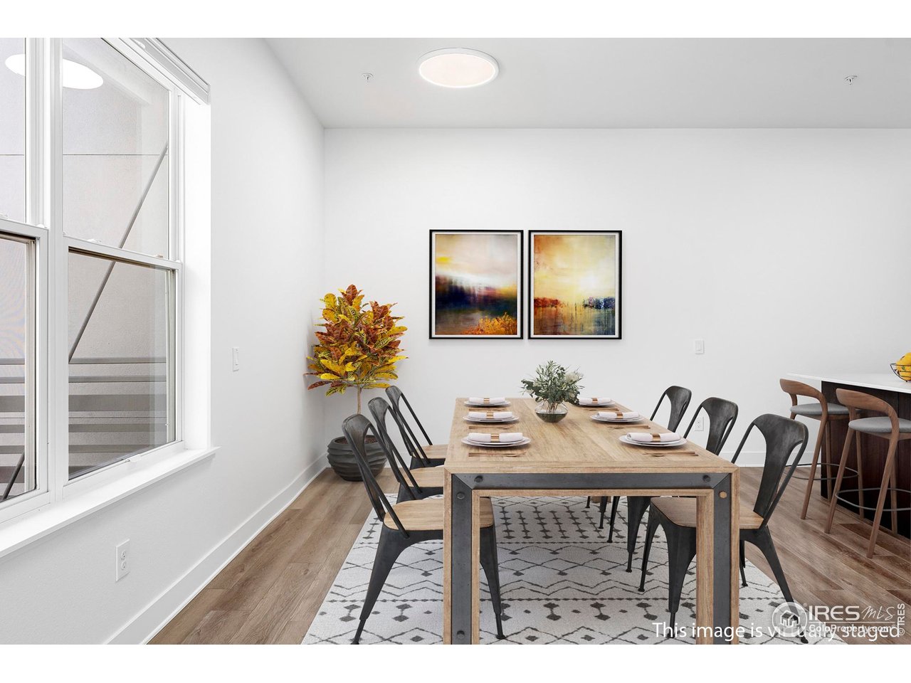 1707 Walnut Street, Unit 208 Boulder, CO 80302 - Photo 5 of 30 a view of a dining room with furniture and wooden floor