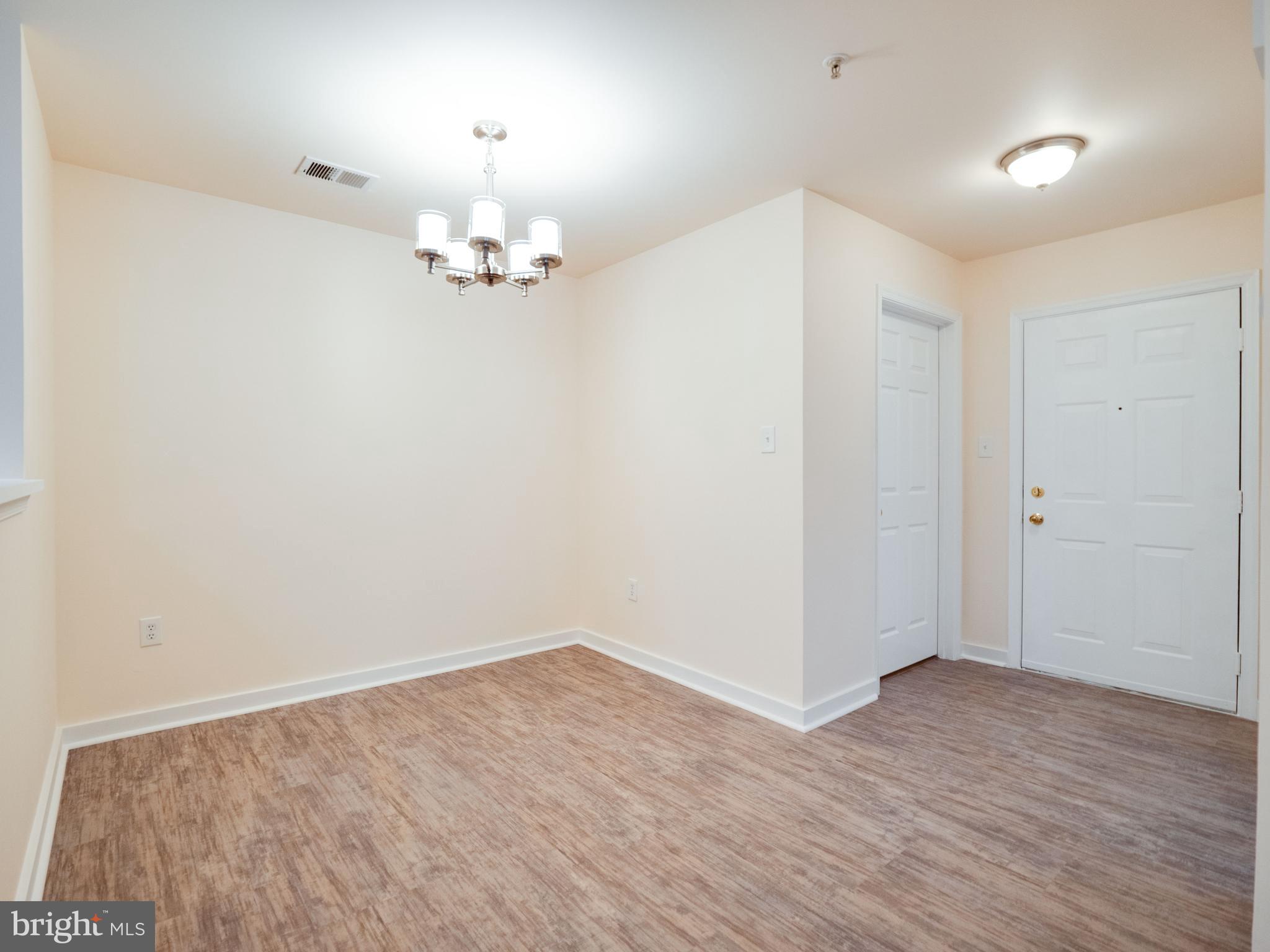 1049 Gardenview Loop, Unit 201 Woodbridge, VA 22191 - Photo 7 of 23 Dining Room/Laundry Room/Main Entrance