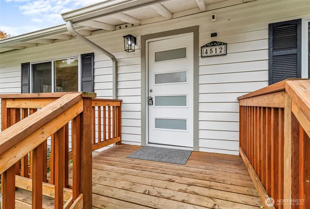 a view of porch with wooden floor and stairs