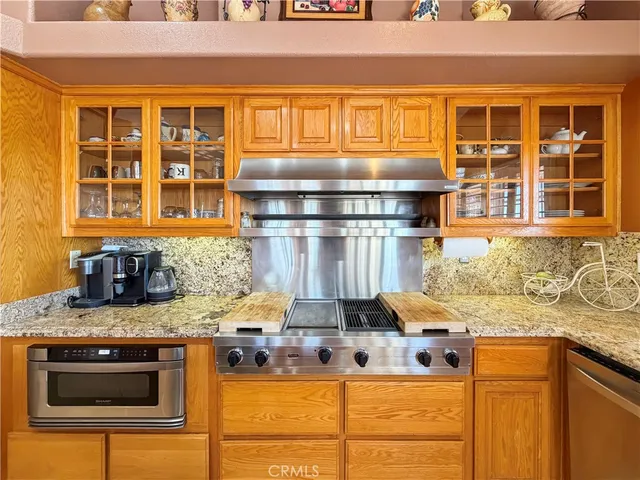 a kitchen with a stove and a sink