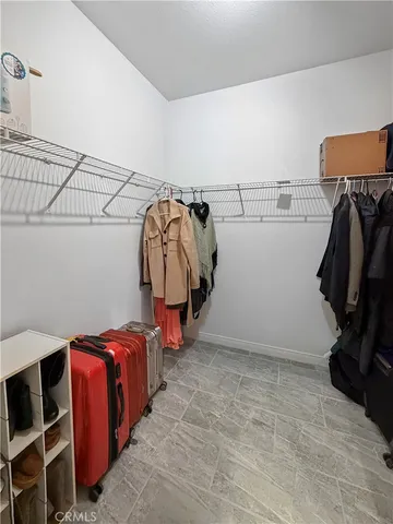 a view of storage and utility room with two washing machine