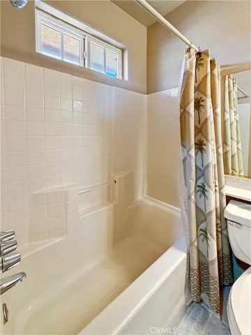 a bathroom with a sink a toilet and bathtub