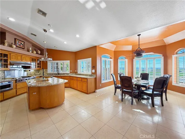 a view of a dining room with furniture window and outside view