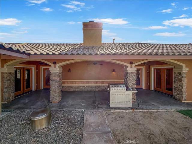 a view of a house with a sink and a yard