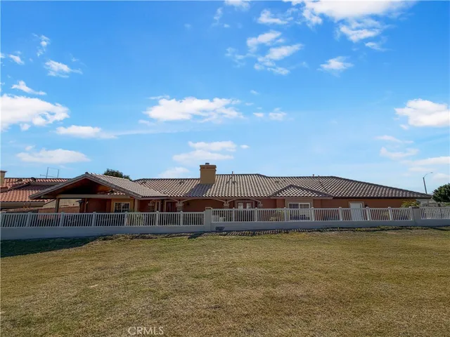a front view of a house with swimming pool