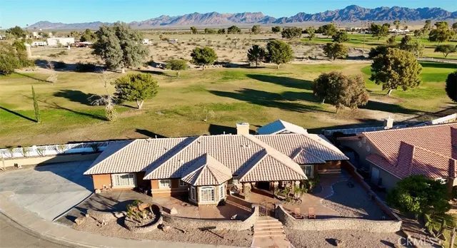 a view of house with outdoor space and sitting area