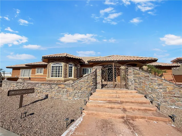 a view of a patio with couches chairs and potted plants