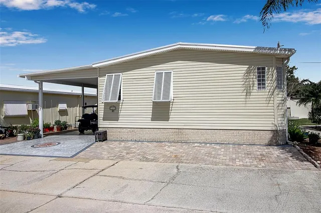 a dining room with stainless steel appliances kitchen island granite countertop a table and chairs