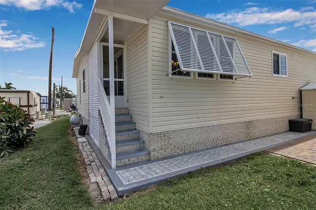a kitchen with a sink cabinets and window