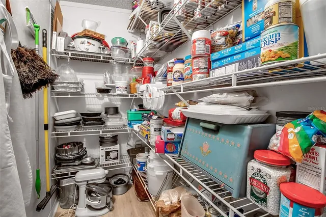 a bedroom with two beds and a couch