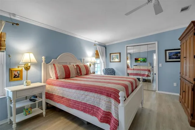 an aerial view of a tennis ground with a white house