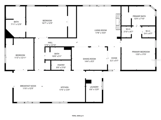 a view of a livingroom with furniture and staircase