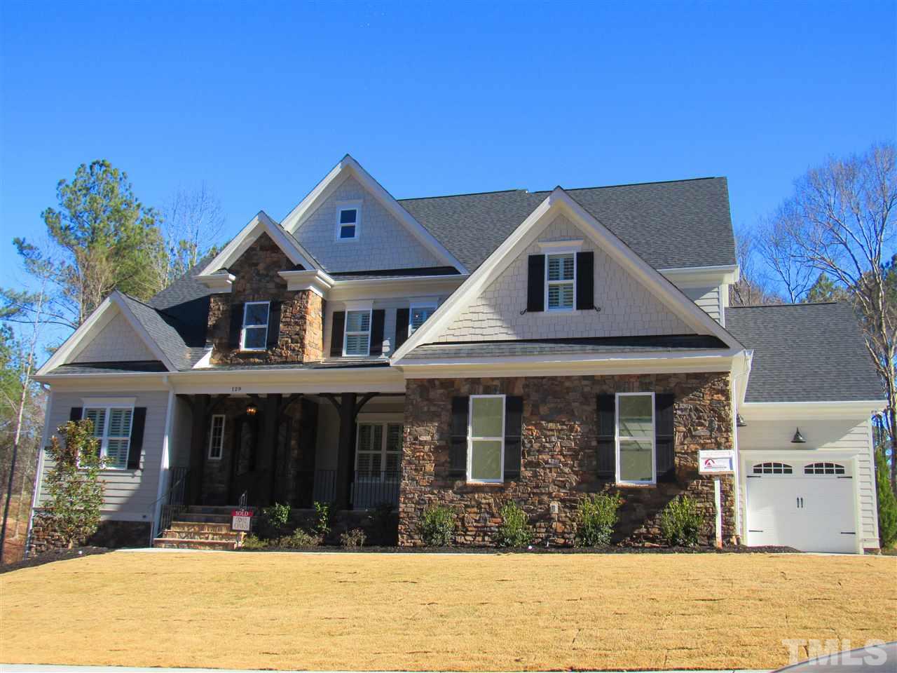 129 Roseroot Court Holly Springs, NC 27540 - Photo 1 of 1 a front view of a house with a yard