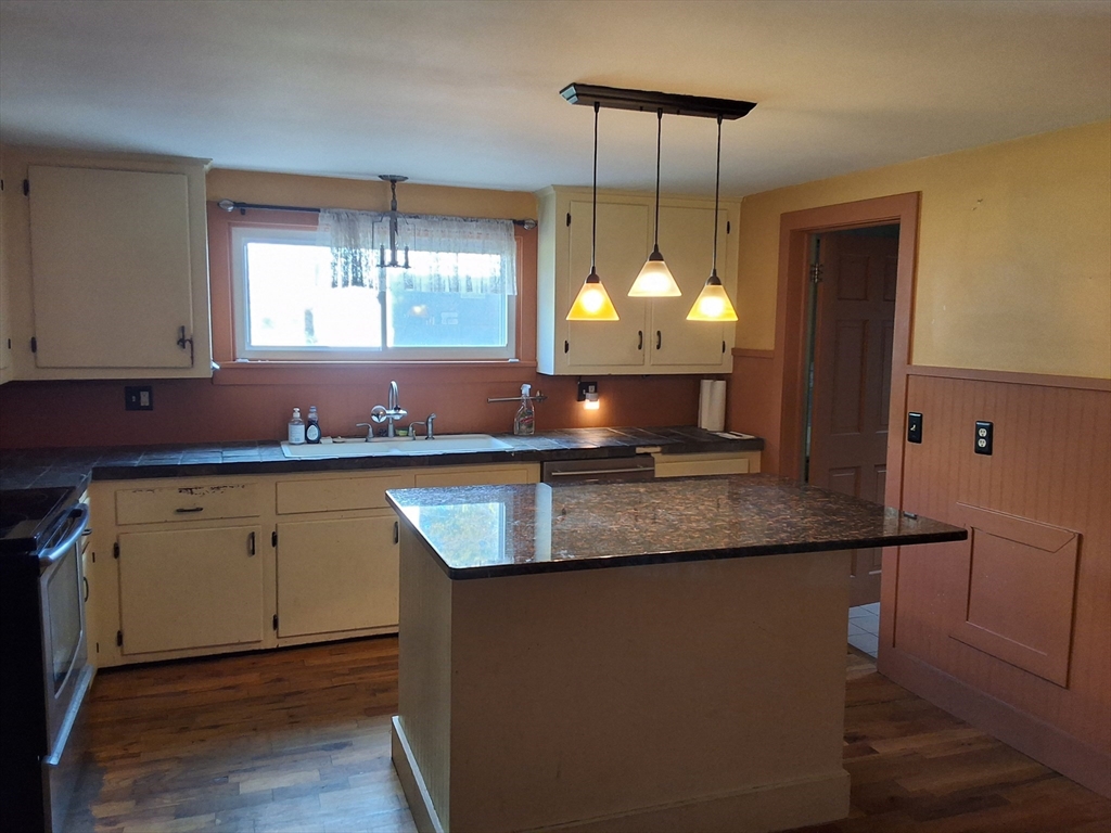 35 Pleasant Street Ware, MA 01082 - Photo 8 of 30 a kitchen with cabinets and window