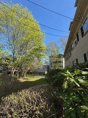 15 Harris Street, Unit 2 Marblehead, MA 01945 - Photo 10 of 12 a view of a back yard of the house and green space