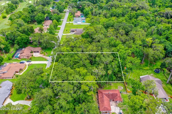 an aerial view of houses with yard