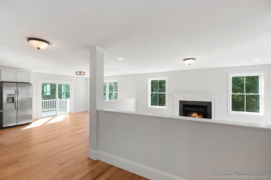 23 Ipswich Road Topsfield, MA 01983 - Photo 12 of 41 a view of an empty room with wooden floor and a window