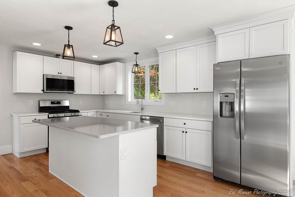 23 Ipswich Road Topsfield, MA 01983 - Photo 13 of 41 a kitchen with a refrigerator a sink and wooden floor