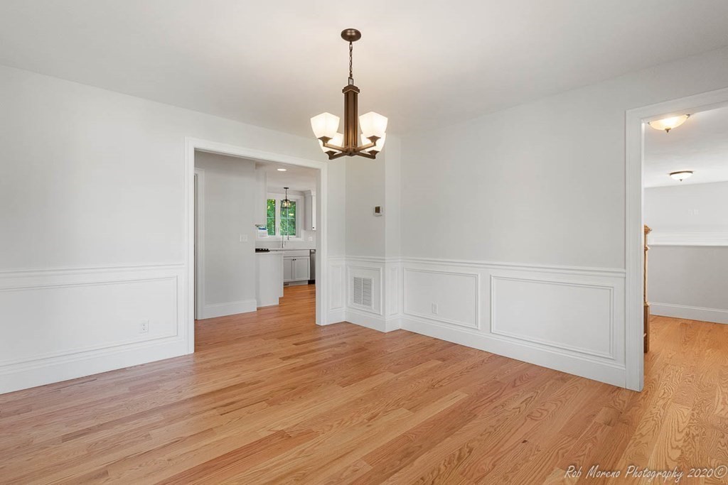 23 Ipswich Road Topsfield, MA 01983 - Photo 20 of 41 a view of a room with wooden floor cabinet and windows