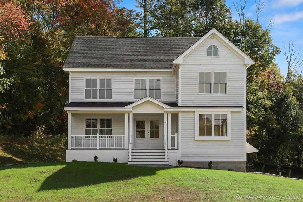 23 Ipswich Road Topsfield, MA 01983 - Photo 2 of 41 a front view of a house with a yard