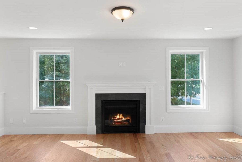 23 Ipswich Road Topsfield, MA 01983 - Photo 10 of 41 a view of an empty room with a window and fireplace
