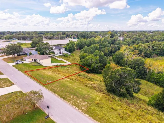 a view of a lake with a yard