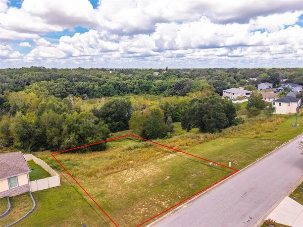 a view of a swimming pool with a yard