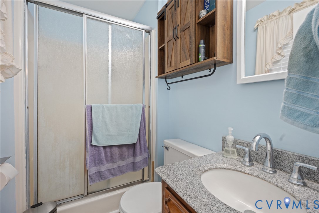 7749 Drexelbrook Road Chesterfield, VA 23832 - Photo 17 of 24 a bathroom with a granite countertop sink and a mirror