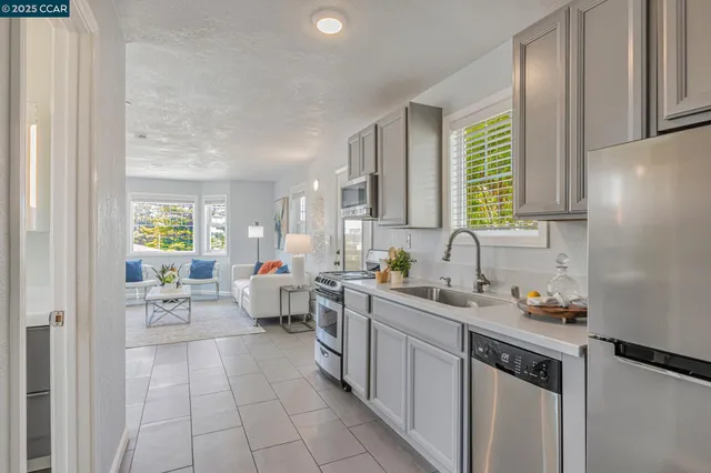 a kitchen with a sink cabinets and window