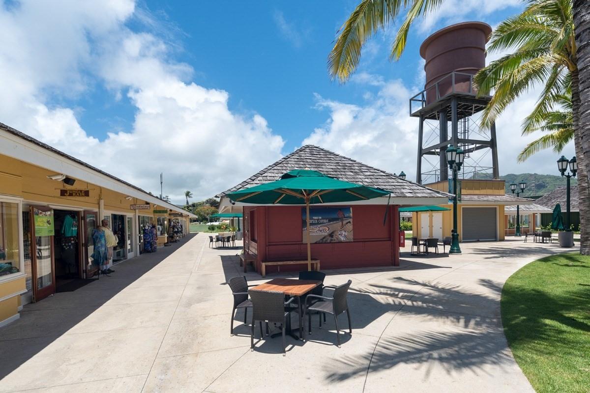 525 Aleka Loop, Unit H7 Kapaa, HI 96746 - Photo 29 of 30 a patio table and chairs with potted plants