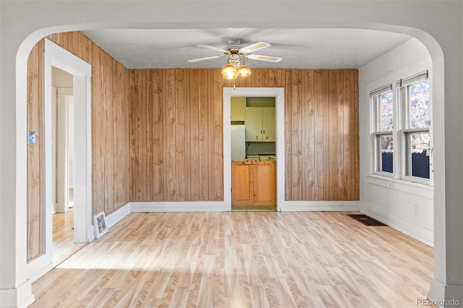 5919 South Bemis Street Littleton, CO 80120 - Photo 12 of 43 a view of a room with wooden floor and a bathroom