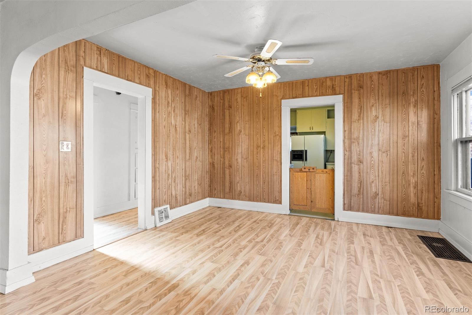 5919 South Bemis Street Littleton, CO 80120 - Photo 14 of 43 a view of a room with wooden floor and closet area