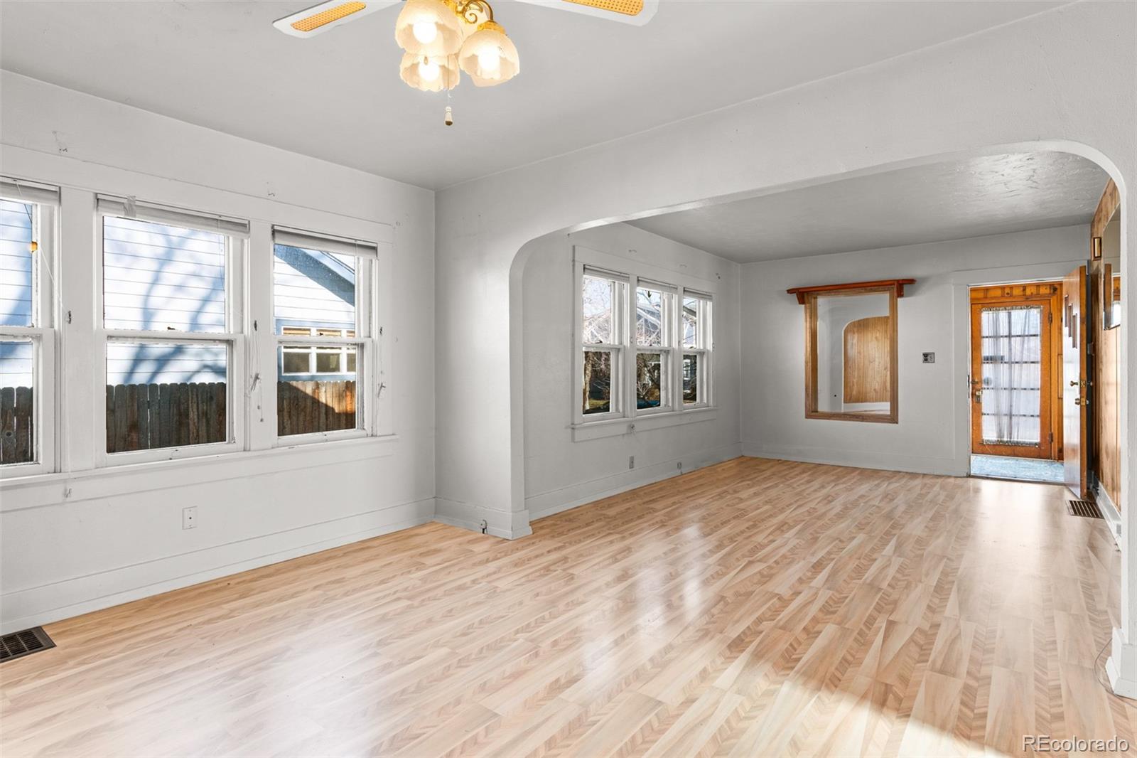 5919 South Bemis Street Littleton, CO 80120 - Photo 16 of 43 a view of empty room with wooden floor and fan