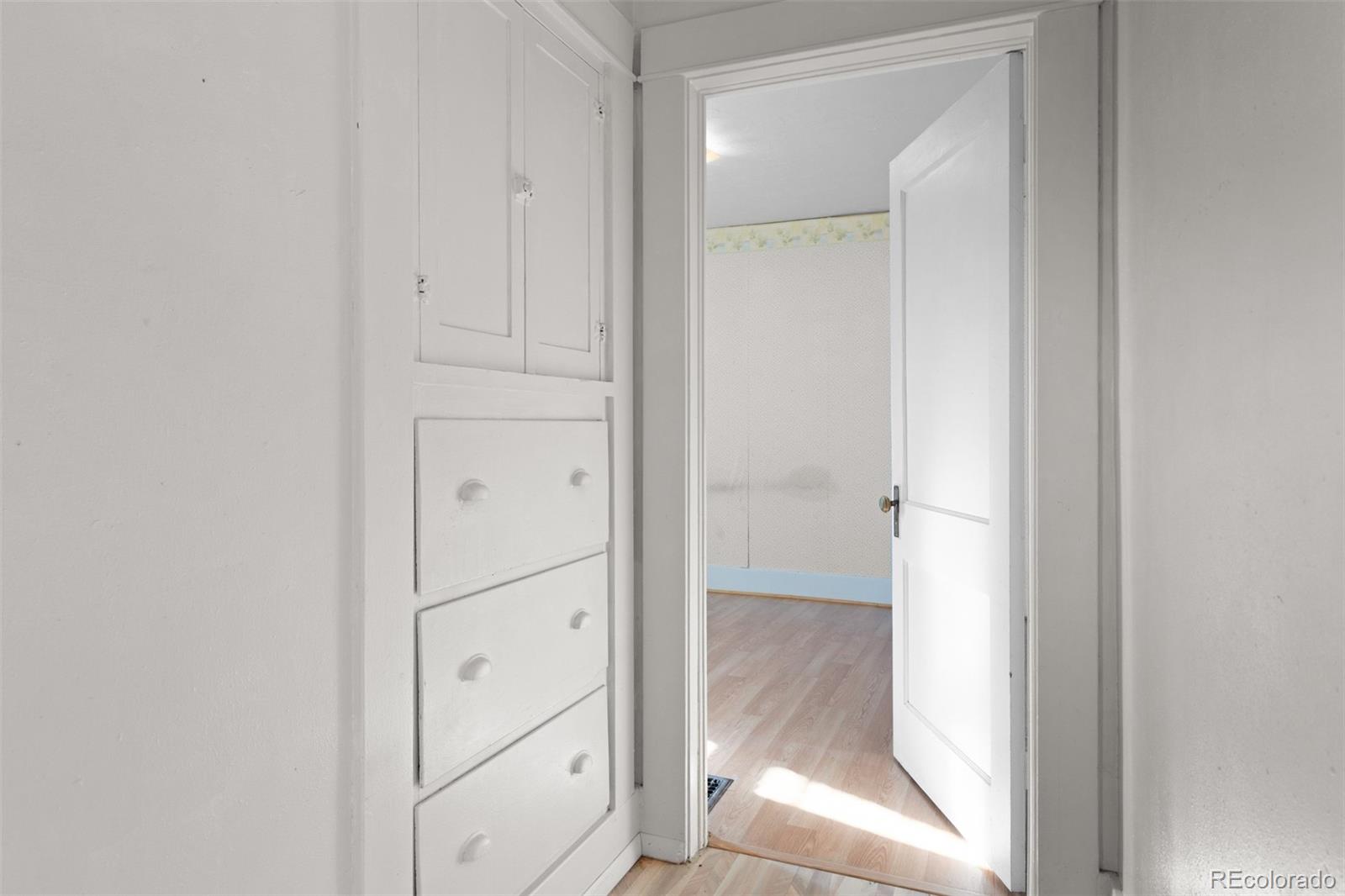 5919 South Bemis Street Littleton, CO 80120 - Photo 25 of 43 a bathroom with a glass shower door